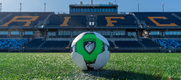 Soccer ball with a Boston Legacy FC logo on the field at Centreville Bank Stadium